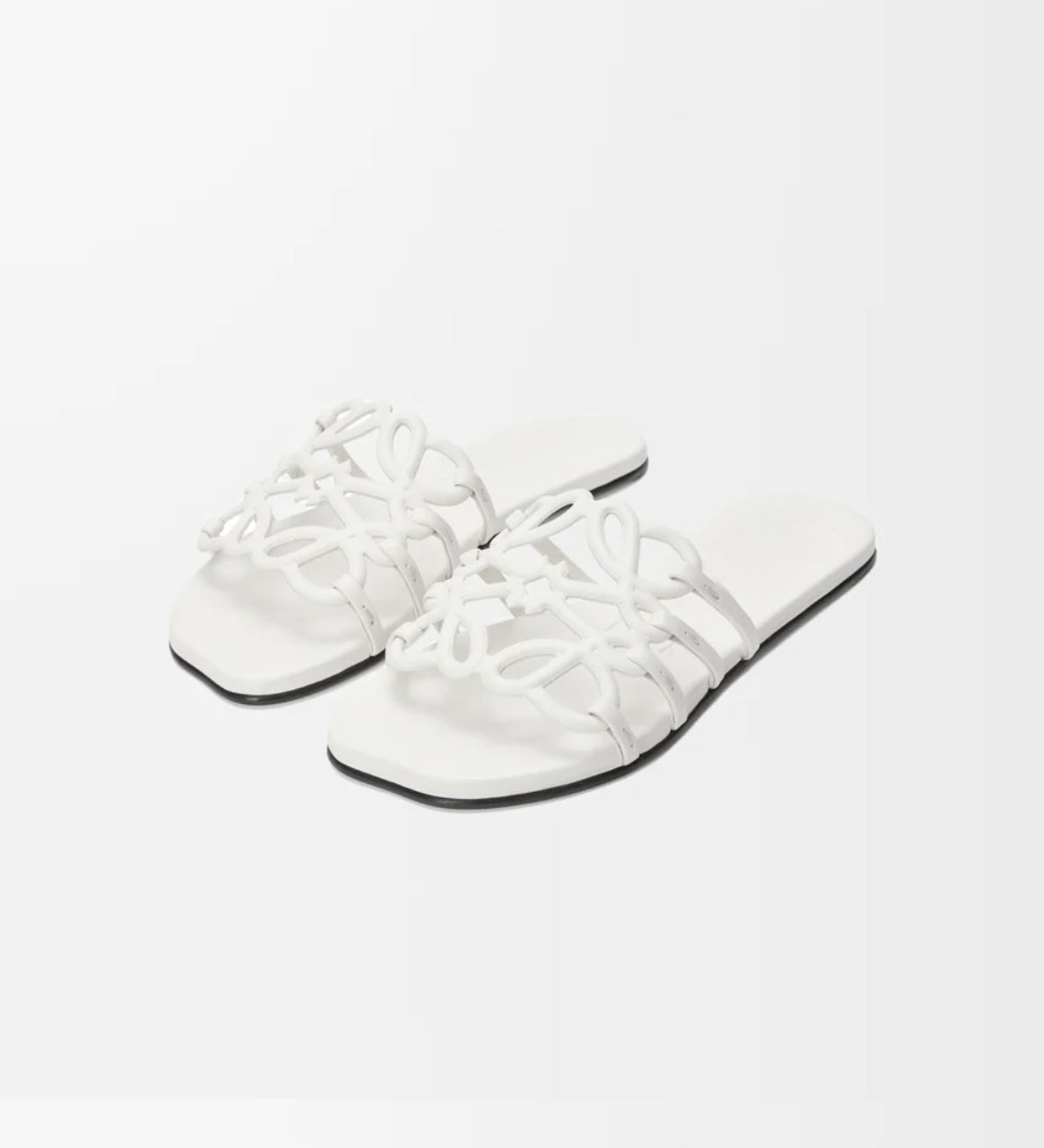 sandalias slider abstractas, sandalias de mujer, sandalias de verano, sandalias elegantes, sandalias cómodas, sandalias minimalistas, sandalias modernas, sandalias abiertas, calzado de verano, sandalias de diseño, sandalias lujo, sandalias planas, sandalias monograma, sandalias chic, sandalias ligeras, sandalias moda mujer, sandalias depaysement, sandalias casuales, sandalias sofisticadas, sandalias esenciales